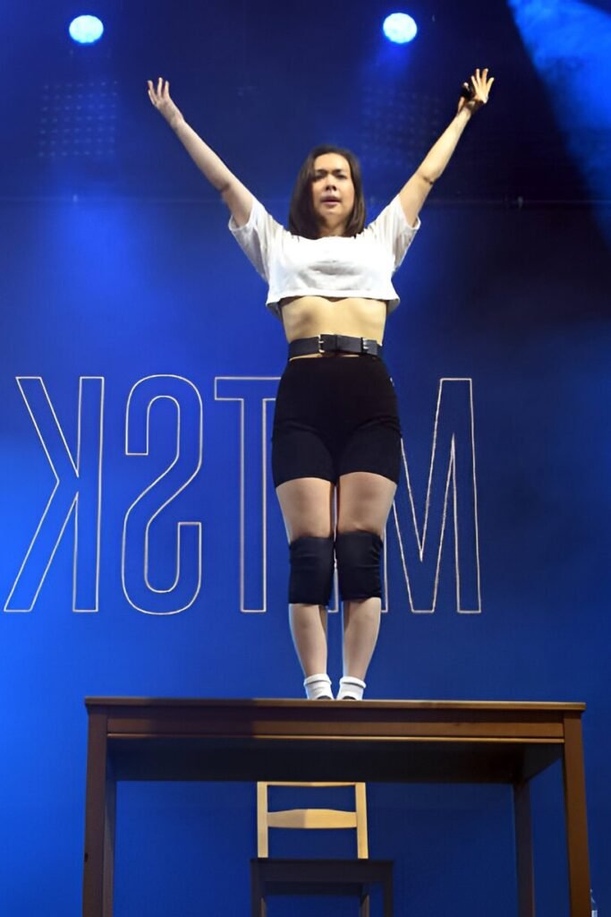White Crop Top + High-Waisted Black Biker Shorts + Black Knee Pads