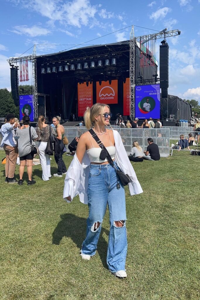 White Crop Top + Oversized White Button-Down + Ripped Wide-Leg Jeans + White Sneakers