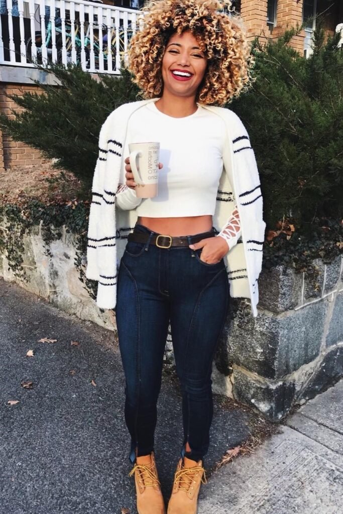 White Cropped Top + Striped Cardigan + Dark Wash Skinny Jeans + Tan Work Boots