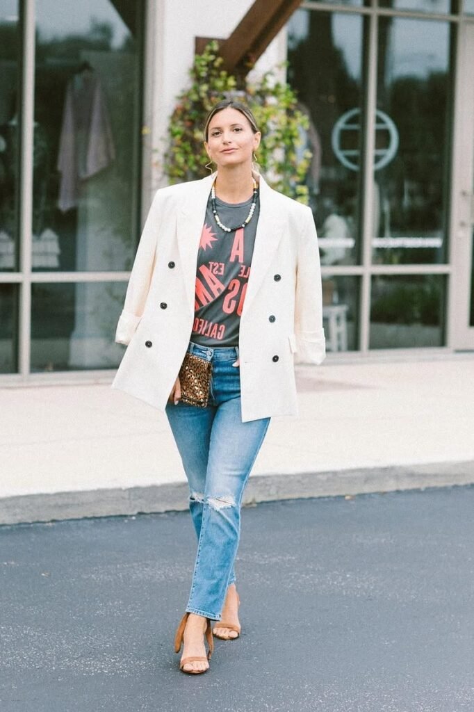 White Double-Breasted Blazer + Graphic T-Shirt + Distressed Light Wash Jeans + Tan Strappy Heels