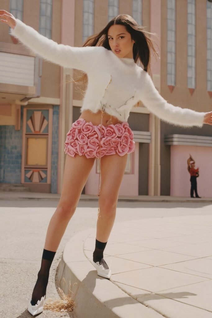 White Fuzzy Cropped Sweater + Pink Rose-Petal Mini Skirt + Black Sheer Socks + White Pointed Heels