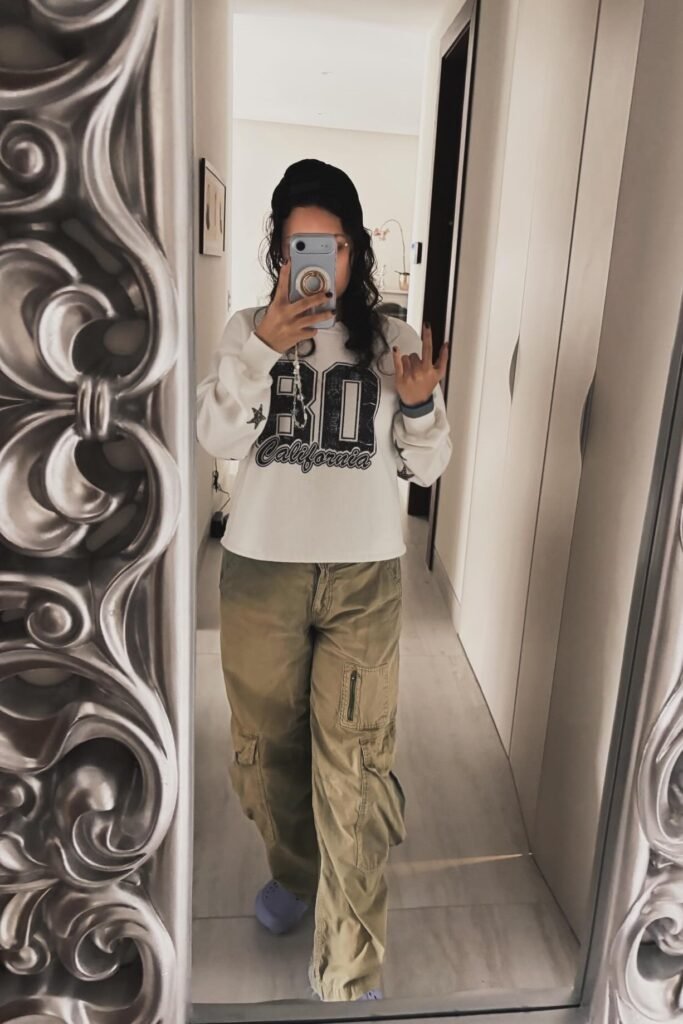 White Graphic Sweatshirt + Khaki Cargo Pants + Blue Clogs