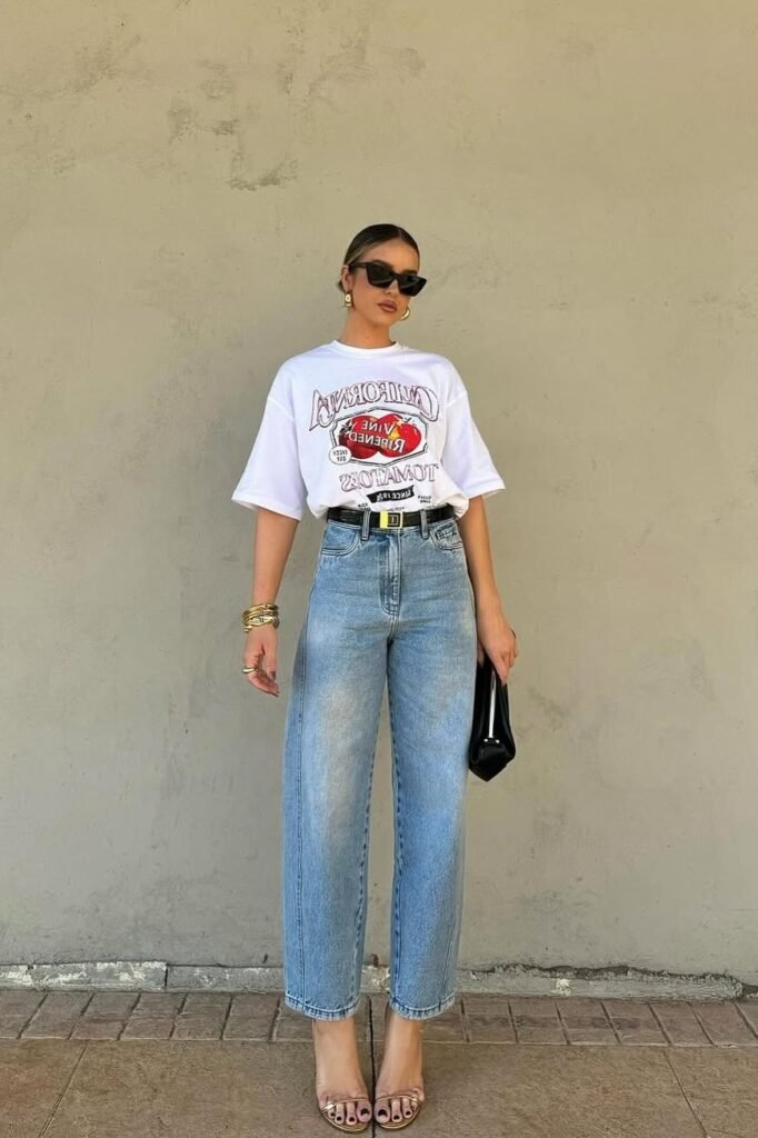 White Graphic T-Shirt + Light Wash Straight-Leg Jeans + Gold Heeled Sandals
