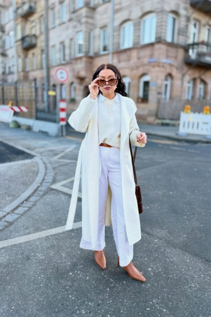White Long Overcoat + White Knit Sweater + White Wide-Leg Trousers + Tan Pointed Boots