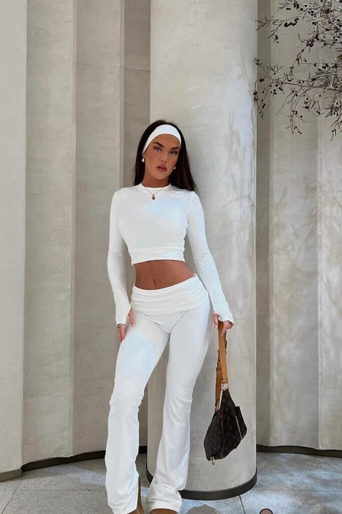 White Long-Sleeve Crop Top + White Low-Rise Flared Trousers + Tan Boots