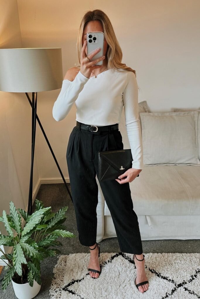 White One-Shoulder Long-Sleeve Top + Black High-Waisted Trousers + Black Strappy Heels + Black Clutch