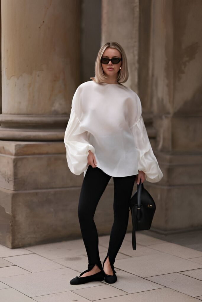 White Oversized Puff-Sleeve Blouse + Black Split-Hem Leggings + Black Ballet Flats