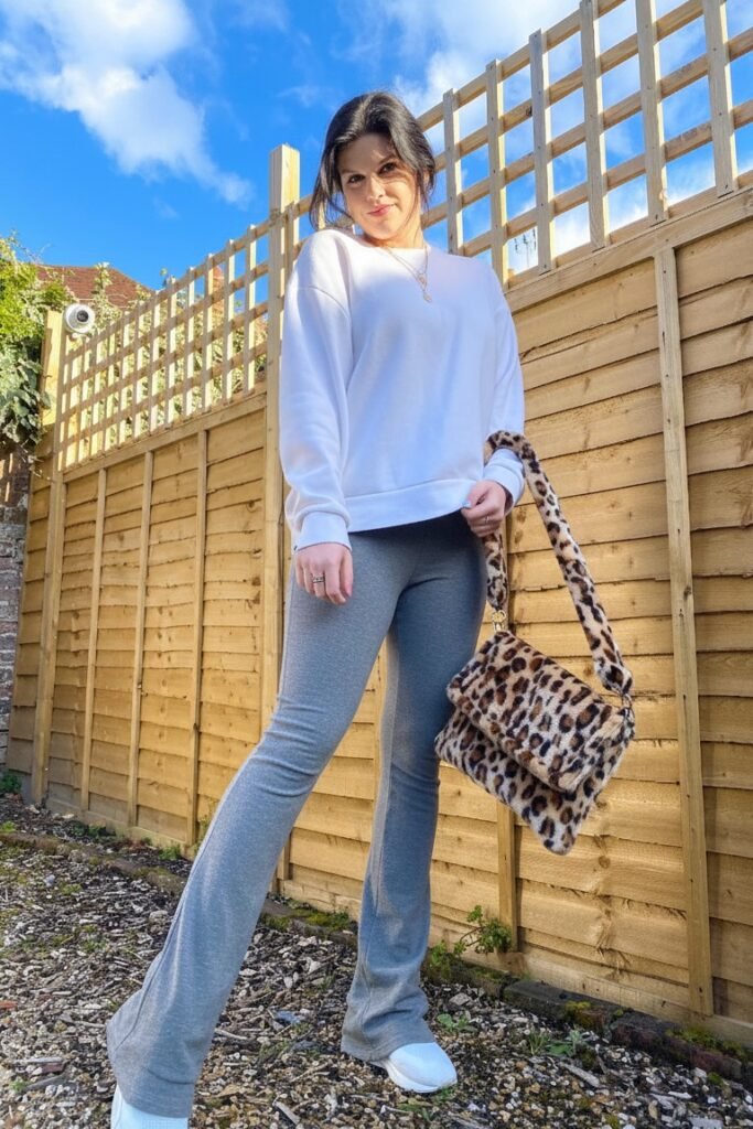 White Oversized Sweatshirt + Grey Flared Leggings + White Sneakers + Leopard Print Bag