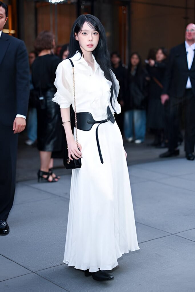 Graphic Crop Top + Black Asymmetrical Skirt + Silver Body Jewelry