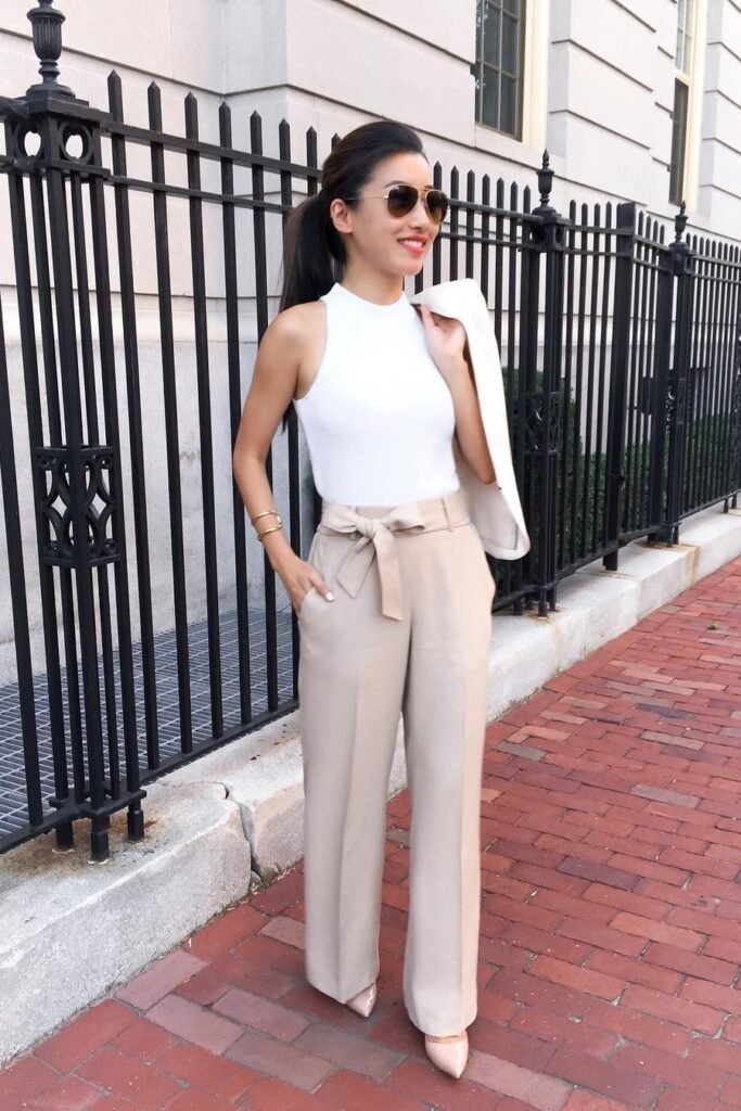 White Sleeveless Mock-Neck Top + Beige Paperbag Waist Trousers + Nude Pointed-Toe Pumps