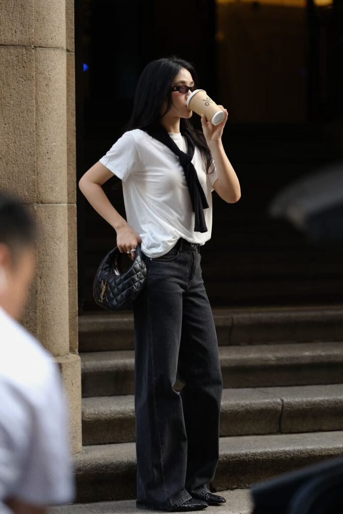 White T-Shirt + Black Cardigan (over shoulders) + Charcoal Wide-Leg Jeans + Black Loafers