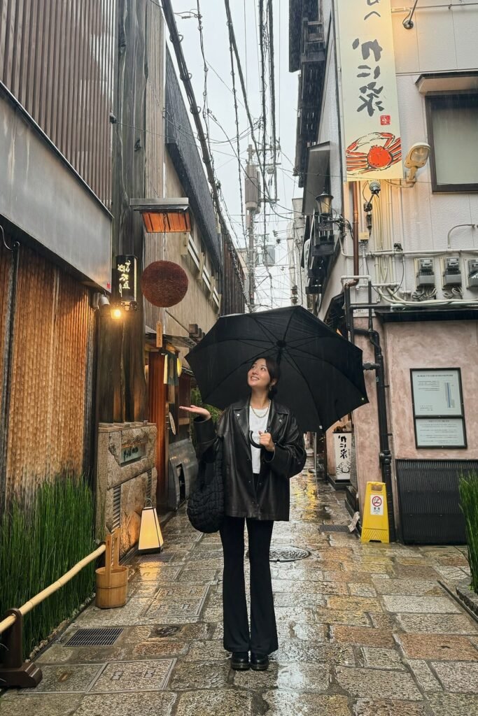 White T-Shirt + Black Leather Oversized Shirt + Black Flared Trousers + Black Platform Shoes