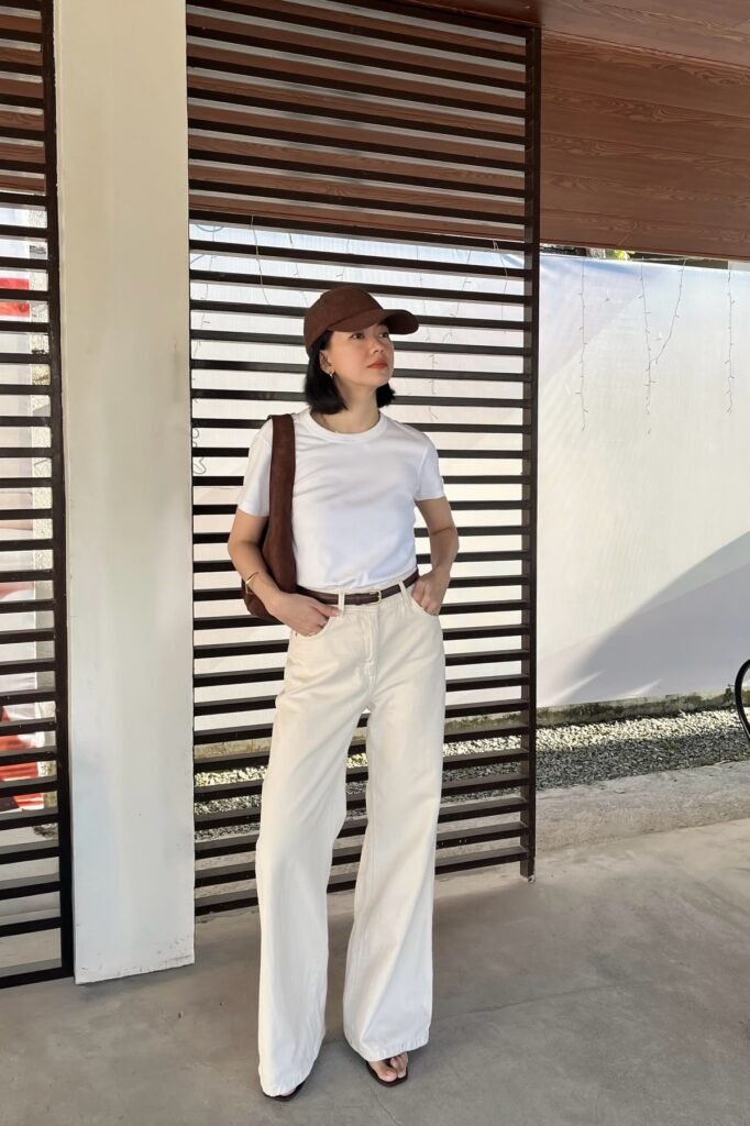 White T-Shirt + Off-White Wide-Leg Jeans + Brown Baseball Cap