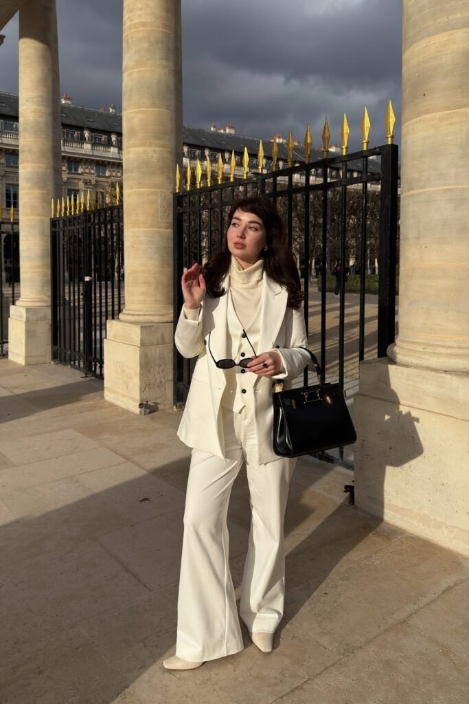 White Three-Piece Suit + Cream Turtleneck + White Pointed Boots
