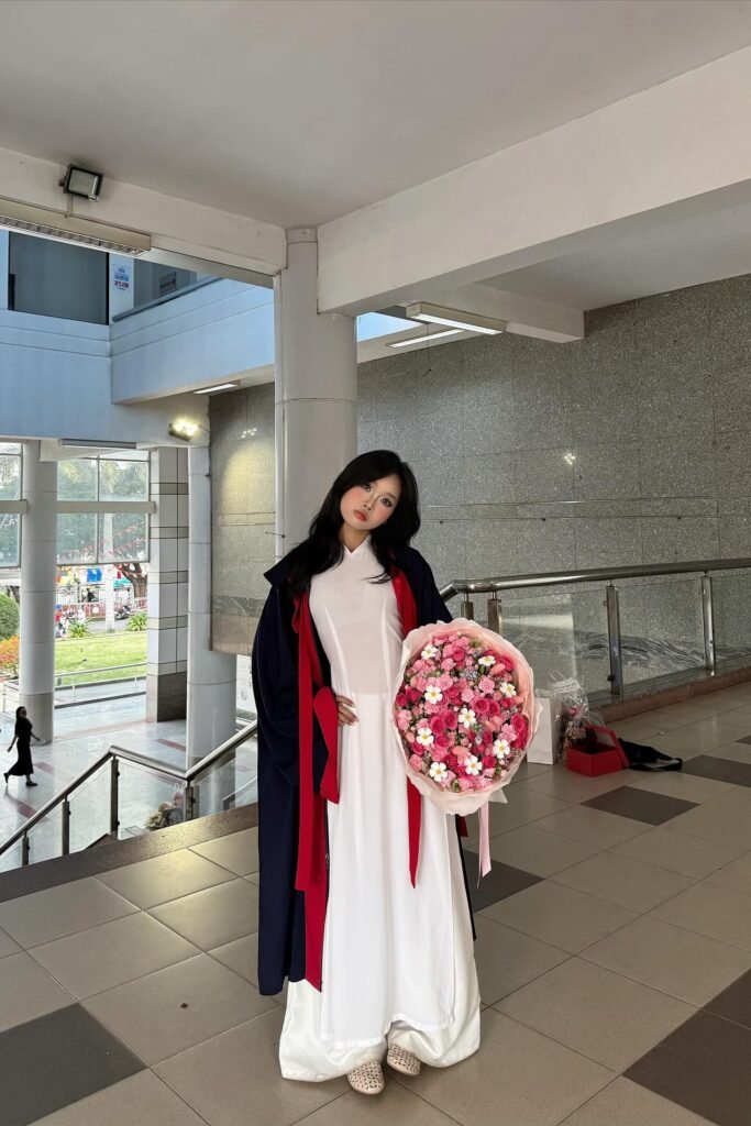 White Traditional Ao Dai + Black Graduation Gown with Red Trim + Cream Perforated Flats