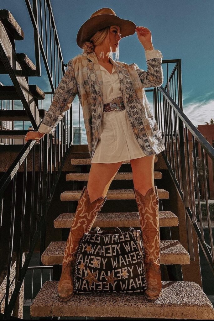 Beige Cowboy Hat + Patterned Blazer + White Shirt Dress + Brown Tooled Leather Belt + Tall Tan Embroidered Boots