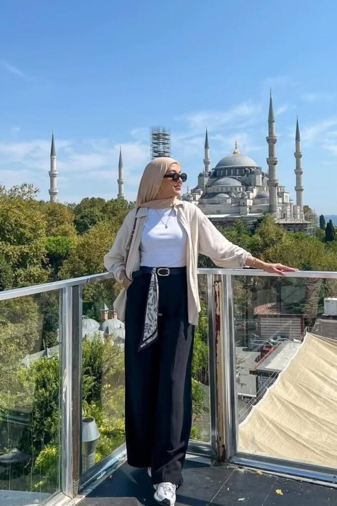 Beige Oversized Shirt + White Bodysuit + Black Wide-Leg Trousers + White Sneakers