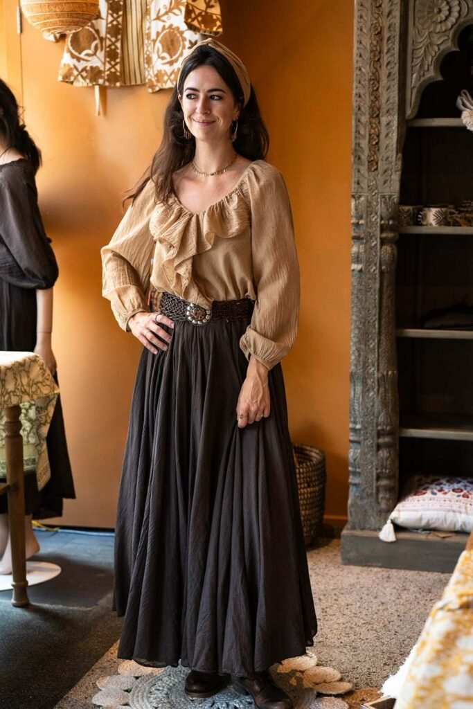 Beige Ruffled Long-Sleeve Blouse + Dark Brown Pleated Maxi Skirt + Woven Leather Belt