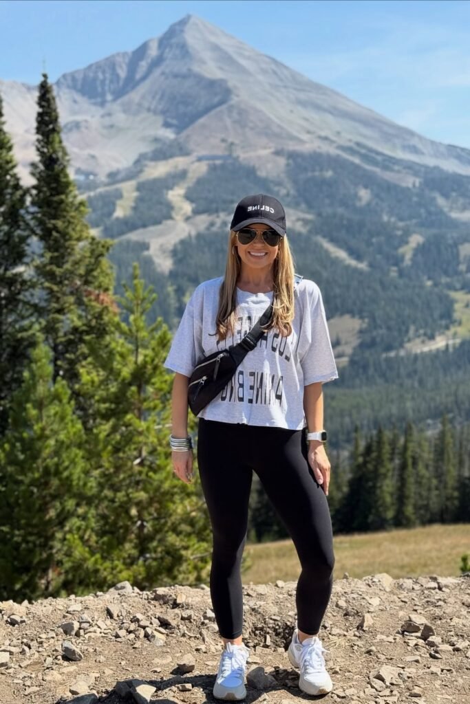 Black Baseball Cap + Oversized Grey Graphic T-shirt + Black Leggings + White Sneakers