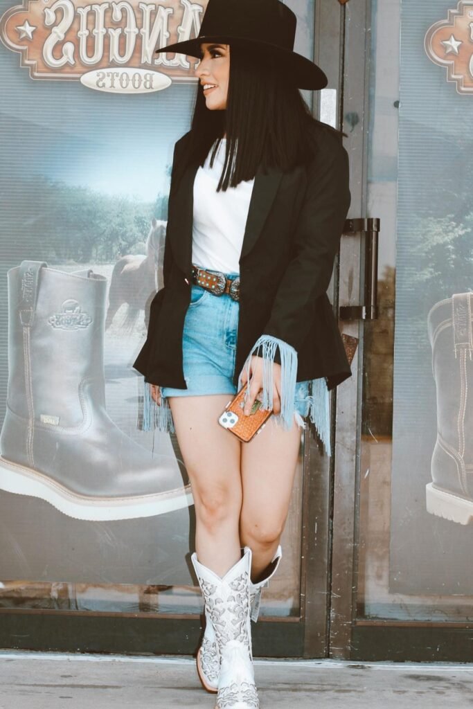 Black Blazer with Blue Fringe + White T-Shirt + Light Wash Denim Shorts + White Western Boots