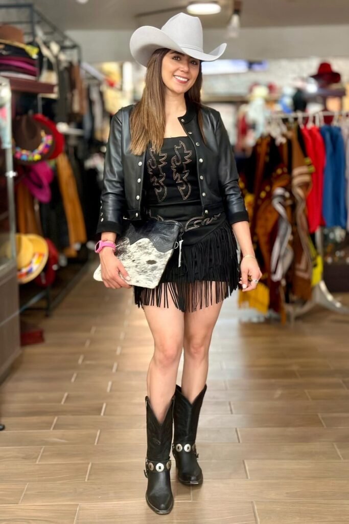 Black Cowboy Graphic Tee + Black Leather Jacket + Black Fringe Mini Skirt + Black Cowboy Boots