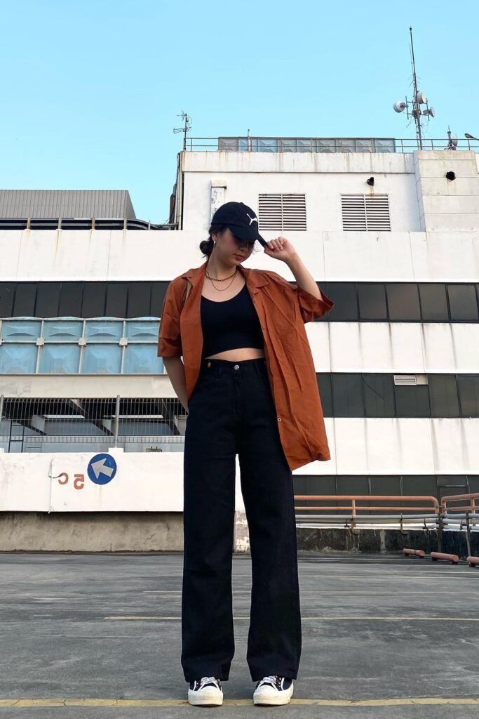 Black Crop Top with Rust Oversized Shirt + Black Wide-leg Jeans + Black and White Platform Sneakers