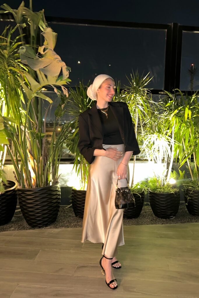 Black Fitted Top + Champagne Satin Midi Skirt + Cropped Black Blazer + Black Strappy Heels