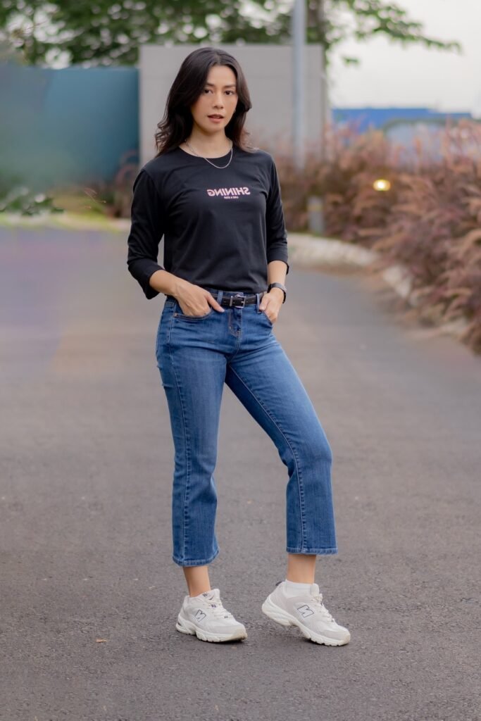  Black Graphic Long-Sleeve Tee + Cropped Blue Jeans + White Athletic Sneakers