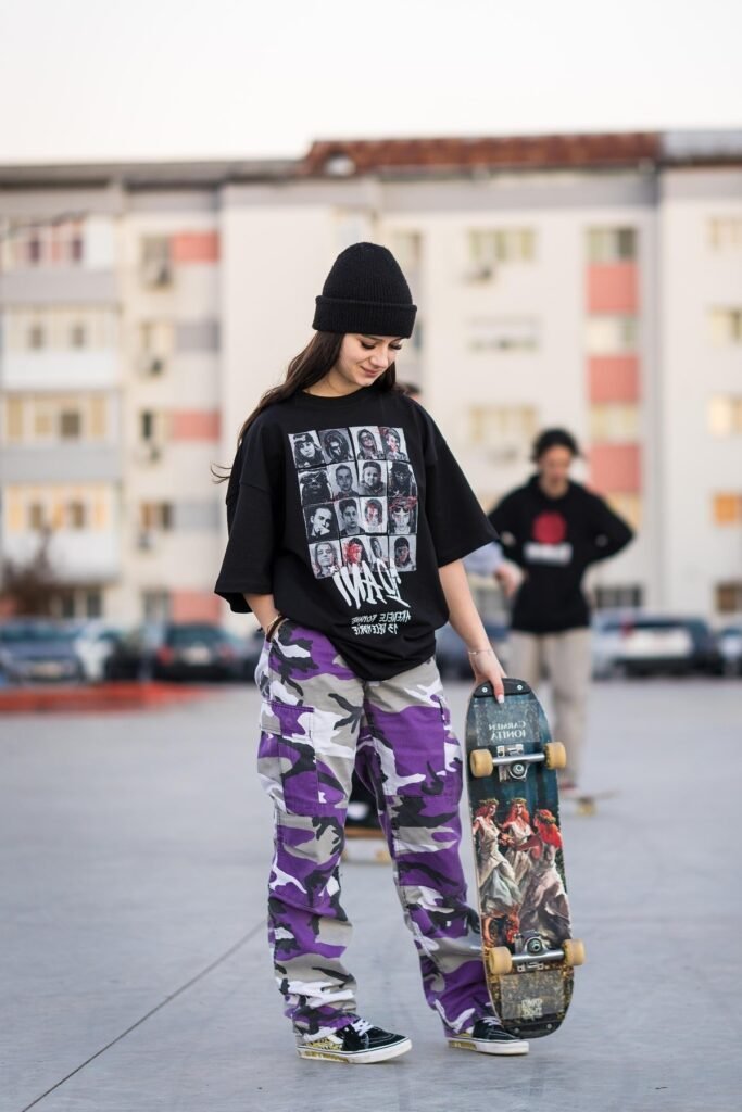 Black Graphic Oversized T-Shirt + Purple Camo Cargo Pants + Black & White Patterned Sneakers
