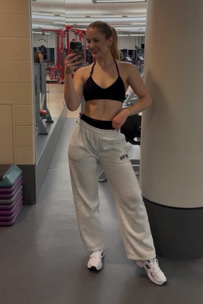 Black Halter-Neck Sports Bra + Heather Grey Baggy Sweatpants + White Sneakers