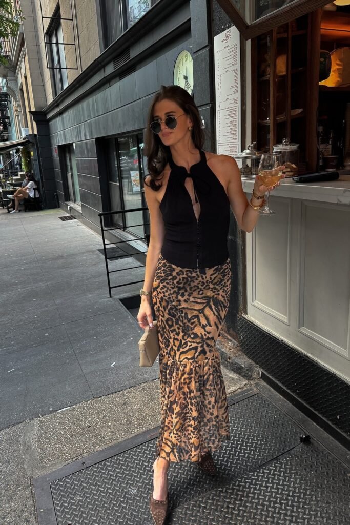 Black Halter Neck Top + Leopard Print Mermaid Skirt + Brown Studded Heels + Beige Clutch