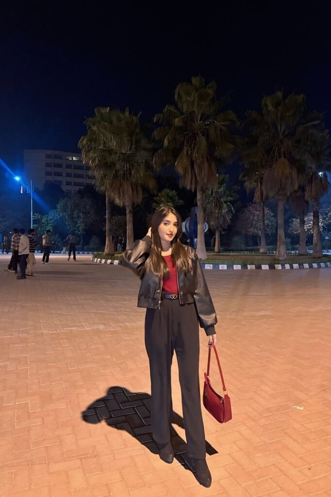 Black Leather Bomber Jacket + Burgundy Top + Black High-Waisted Trousers + Black Boots