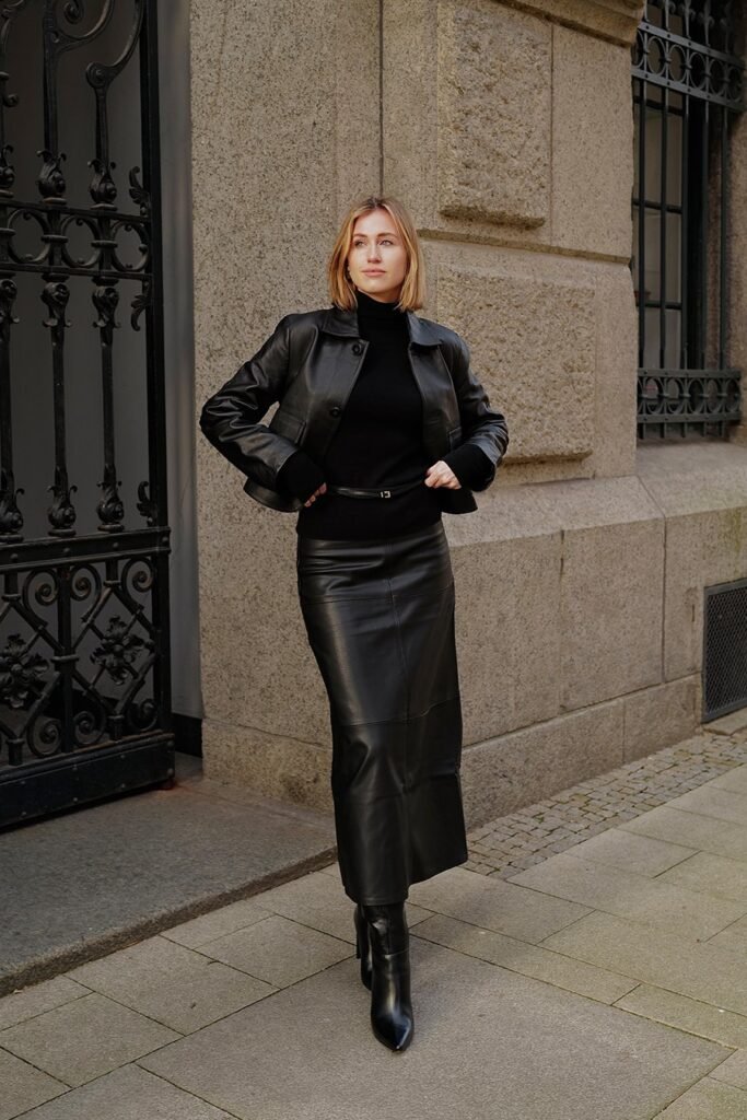 Black Leather Jacket + Black Turtleneck + Black Leather Maxi Skirt + Black Pointed-Toe Boots
