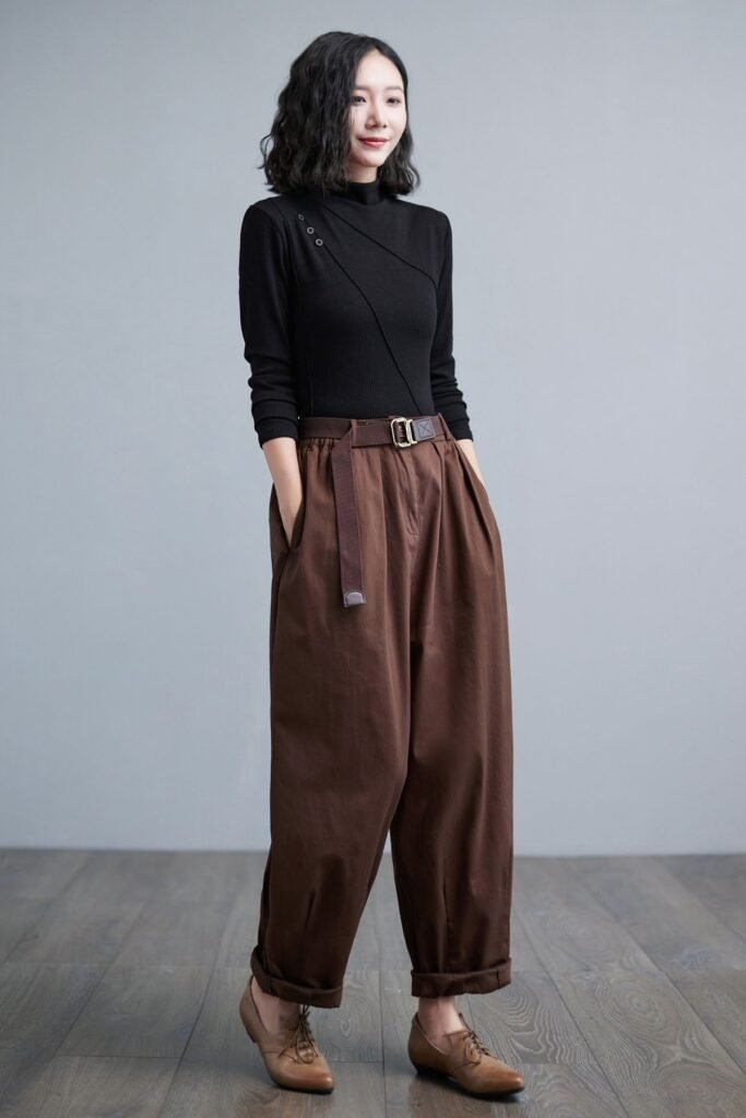 Black Mock-Neck Top + Coffee Brown Tapered Trousers + Brown Leather Lace-Up Shoes + Brown Canvas Belt