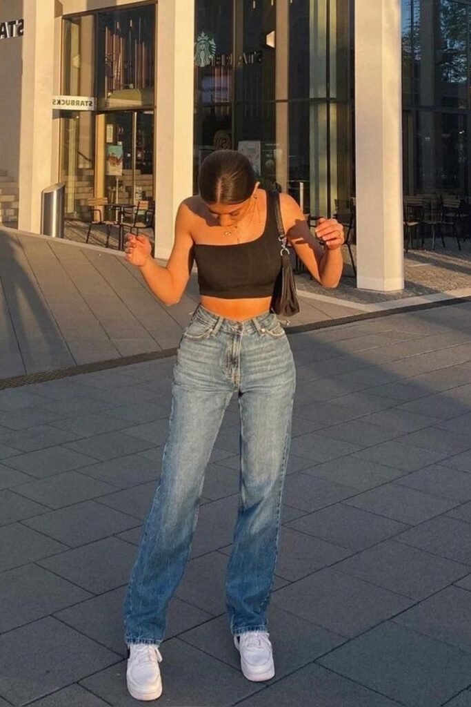 Black One-Shoulder Crop Top + High-Waisted Straight Leg Blue Jeans + White Sneakers