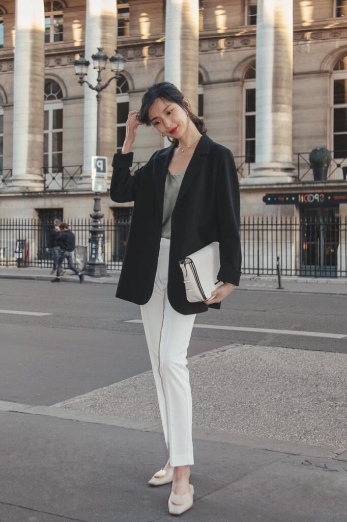 Black Oversized Blazer + Sage Green Silk Camisole + White Slim-Fit Trousers + Cream Mules