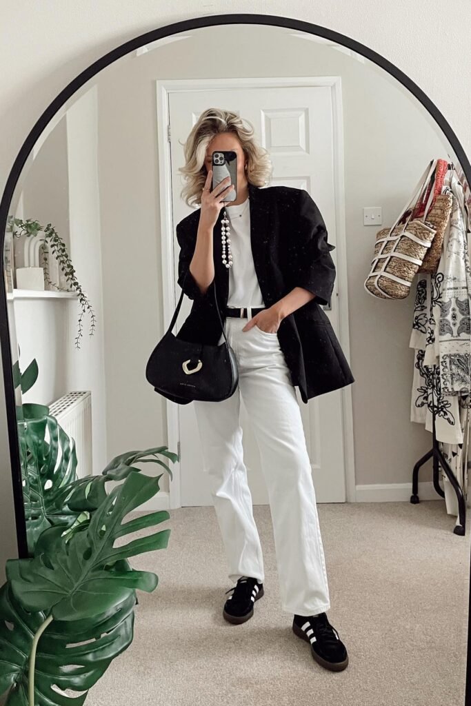 Black Oversized Blazer + White T-Shirt + White Straight-Leg Jeans + Black Sneakers