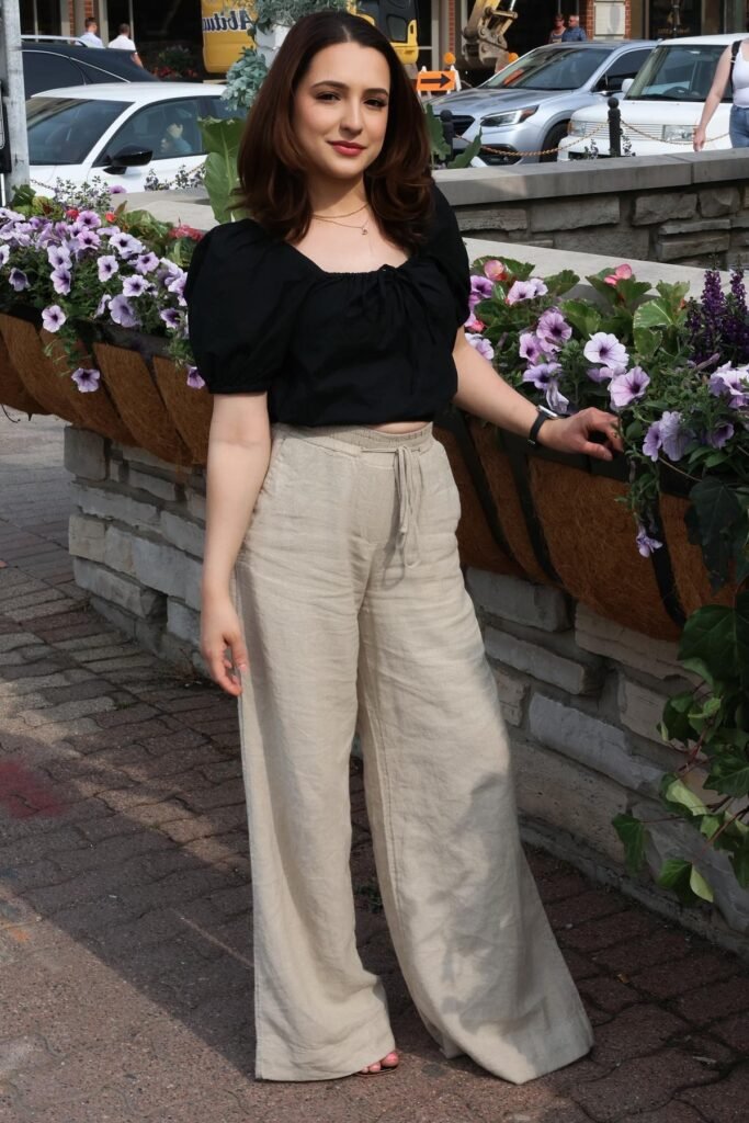 Black Puff-Sleeve Square-Neck Top + Beige Wide-Leg Linen Trousers + Pink Slide Sandals