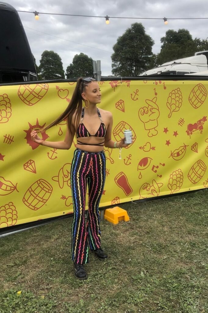 Black Rainbow-Stripe Triangle Top + Matching High-Waisted Flared Trousers + Black Doc Martens