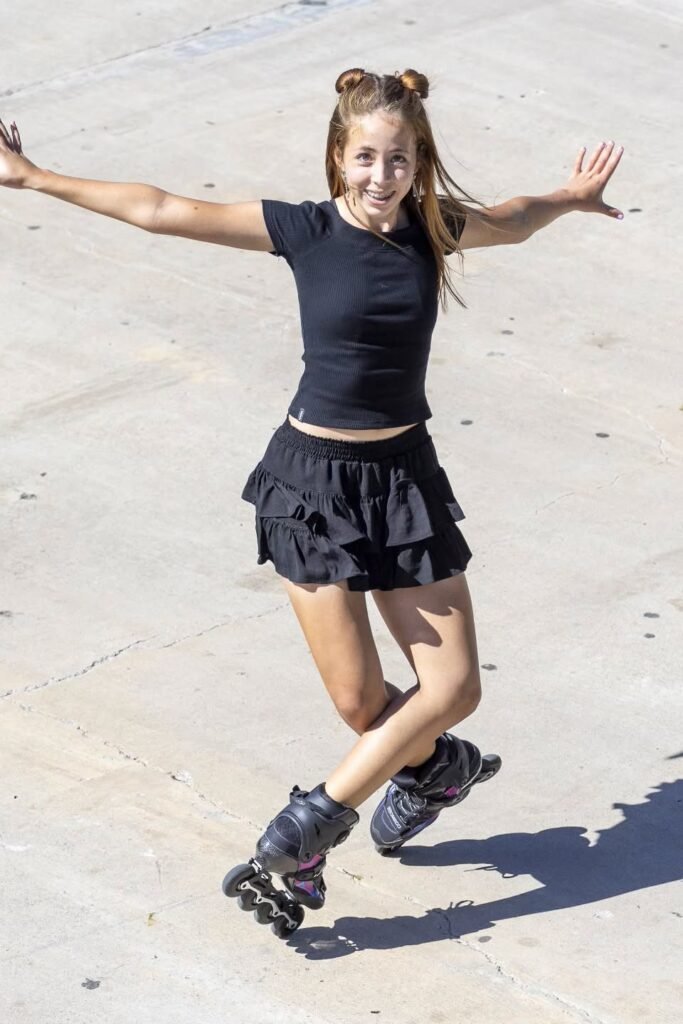 Black Ribbed T-shirt + Black Ruffled Mini Skirt + Black Inline Skates