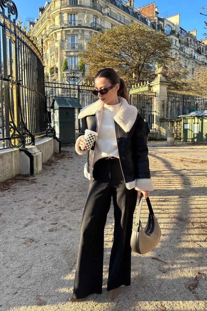 Black Shearling Aviator Jacket + White Mock-Neck Sweater + Black Wide-Leg Trousers