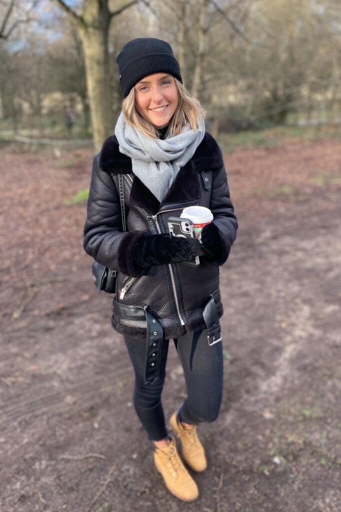 Black Shearling Biker Jacket + Black Skinny Jeans + Tan Lace-Up Boots