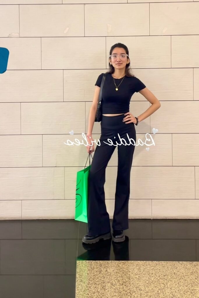 Black Short-Sleeve Crop Top + Black High-Waisted Flared Trousers + Black Platform Boots