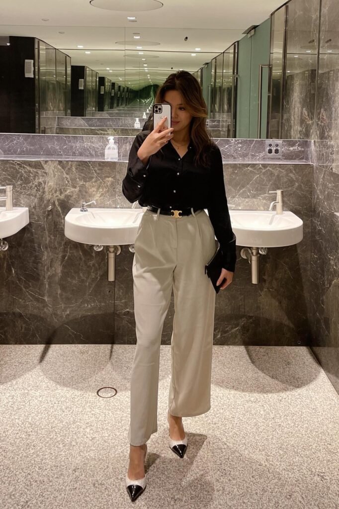 Black Silk Button-Down + Beige High-Waisted Trousers + Black-Tipped Pumps