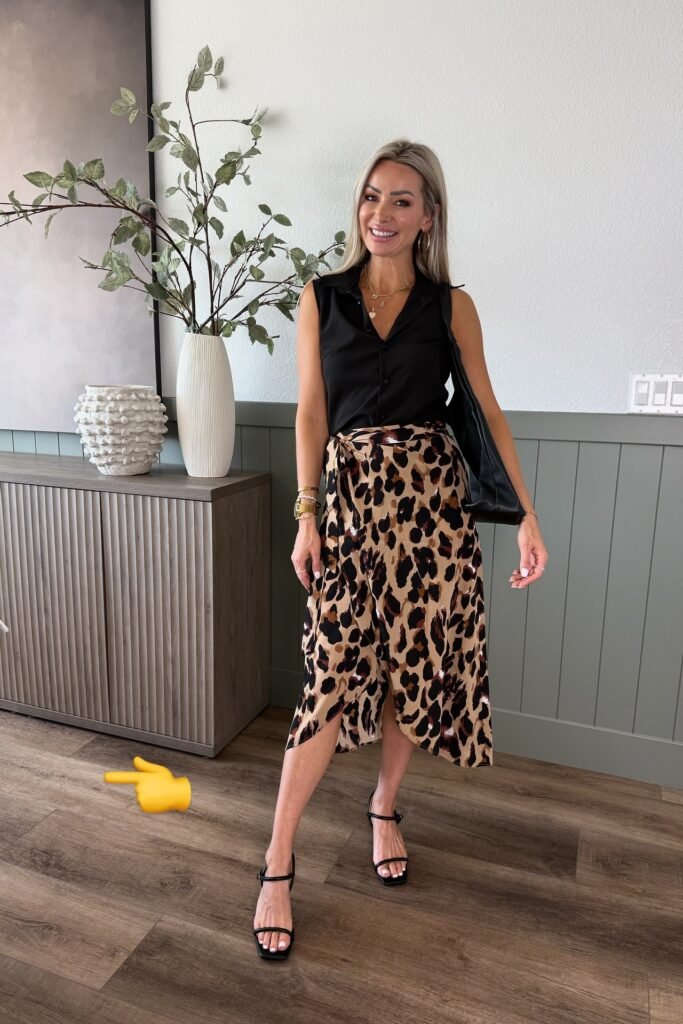 Black Sleeveless Button-Down Shirt + Leopard Print Wrap Skirt + Black Strappy Sandals