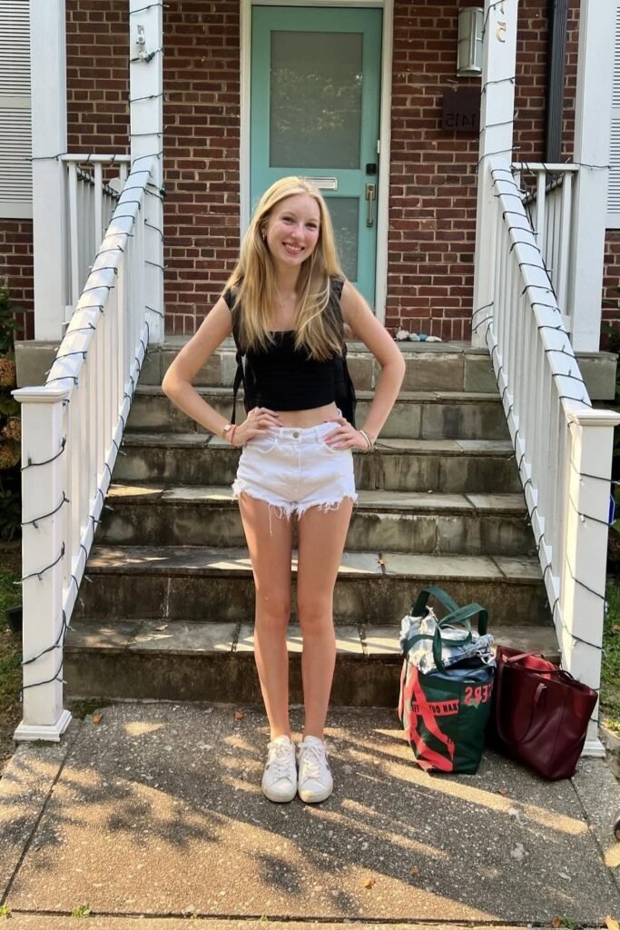 Black Sleeveless Crop Top + White Frayed Denim Shorts + White Sneakers