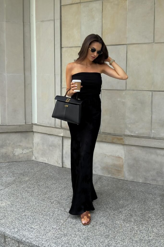 Black Strapless Silk Maxi Dress + Black Top-Handle Bag + Brown Slide Sandals