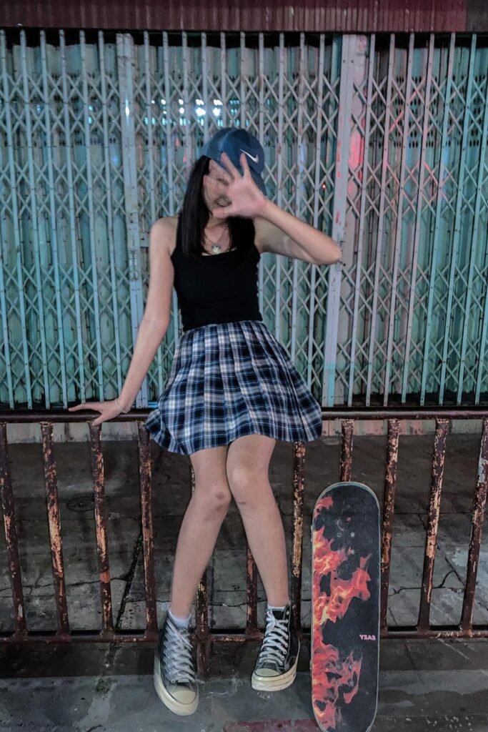 Black Tank Top + Blue Plaid Mini Skirt + Black High-Top Sneakers