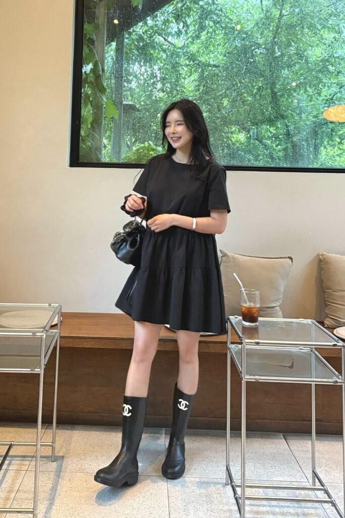 Black Tiered Mini Dress + Chanel Rain Boots + Black Shoulder Bag