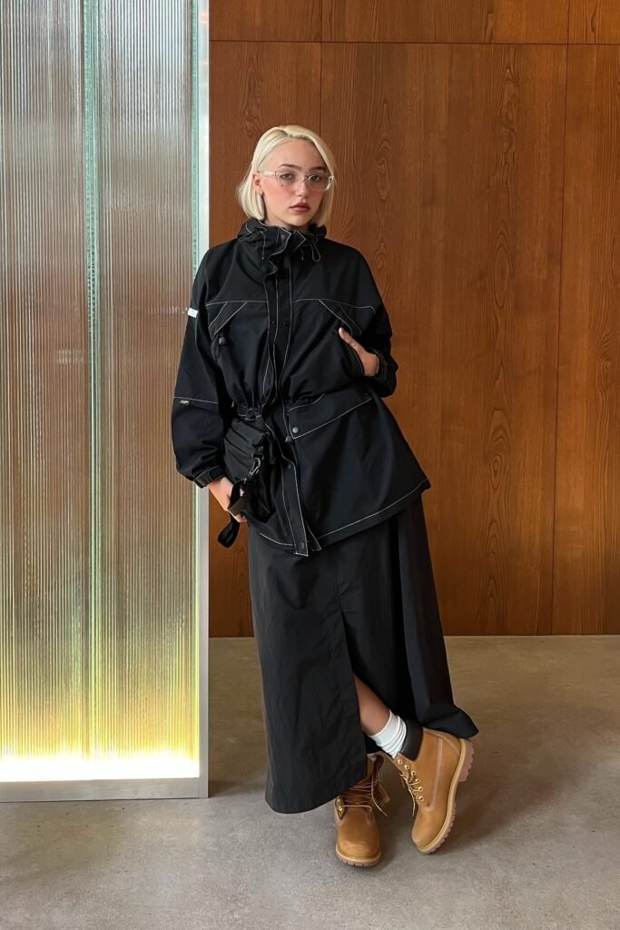 Black Utility Parka + Black Maxi Skirt + White Crew Socks + Tan Work Boots